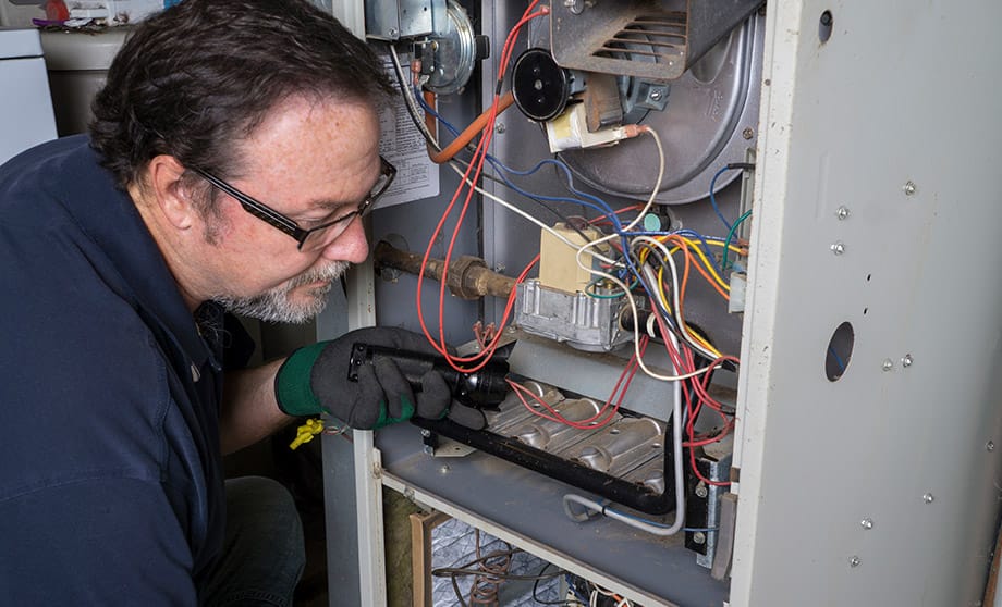 Furnace repair tech working in Tigard